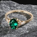 Pattiring Oval Cut Emerald White Gold Cluster Engagement Ring