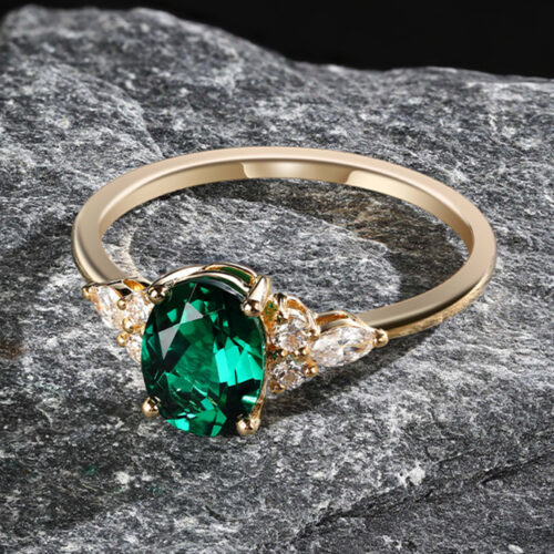 Pattiring Oval Cut Emerald White Gold Cluster Engagement Ring