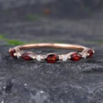 Pattiring Marquise Cut Garnet Rose Gold Half Eternity Wedding Band
