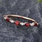 Pattiring Marquise Cut Garnet Rose Gold Half Eternity Wedding Band