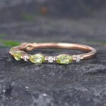 Pattiring Marquise Cut Peridot Rose Gold Half Eternity Wedding Band
