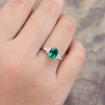 Pattiring Oval Cut Emerald White Gold Cluster Engagement Ring