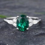 Pattiring Oval Cut Emerald White Gold Cluster Engagement Ring