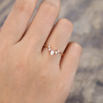 Pattiring Pear Shaped Moissanite Rose Gold Curved Wedding Band