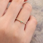 Pattiring Unique Emerald & Moissanite Yellow Gold Curved Wedding Band