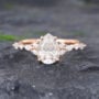 Pattiring Rose Gold 14K Pear Shaped Moissanite and Diamond Engagement Ring