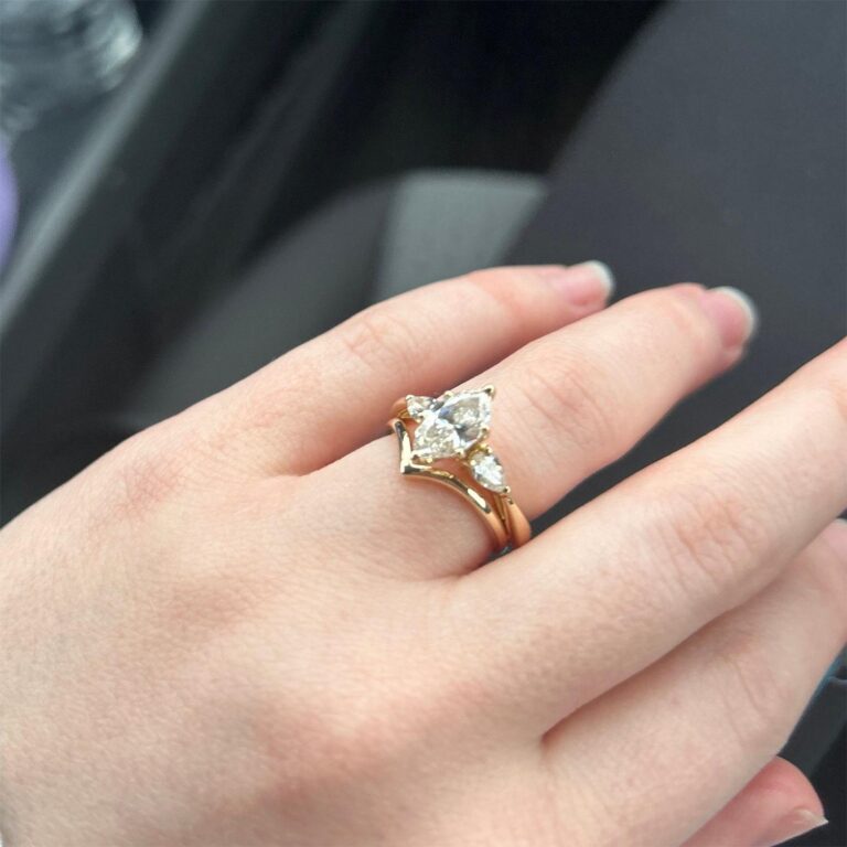 Bride's finger with wedding bands
