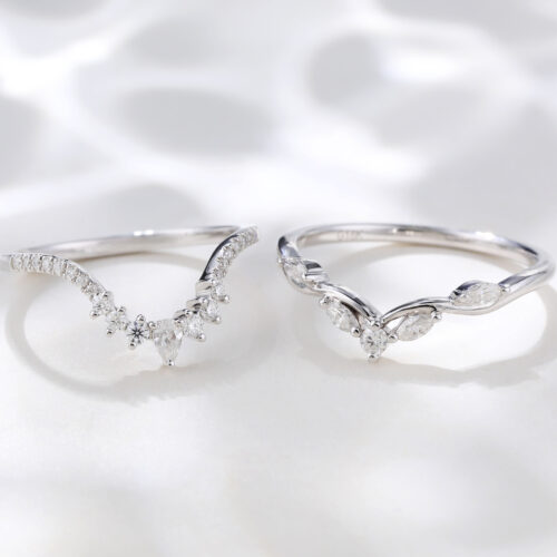 A pair of white gold curved rings