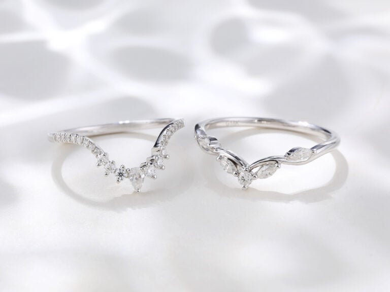A pair of white gold curved rings