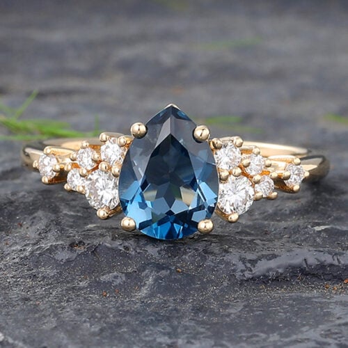Pear Cut London Blue Topaz Engagement Ring with Sparkling Cluster