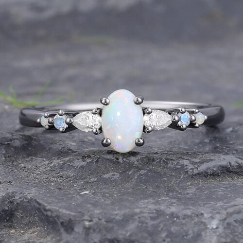 Oval Cut Opal Engagement Ring with Sparkling Accents